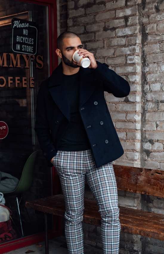 men in black jacket and plaid pant