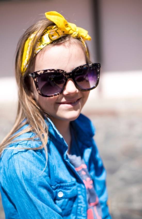 Cute girl wearing yellow knot headband and sunglasses