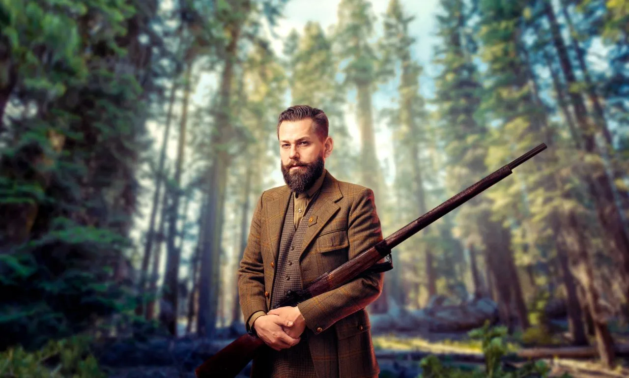 Man in vintage hunting clothes and rifle